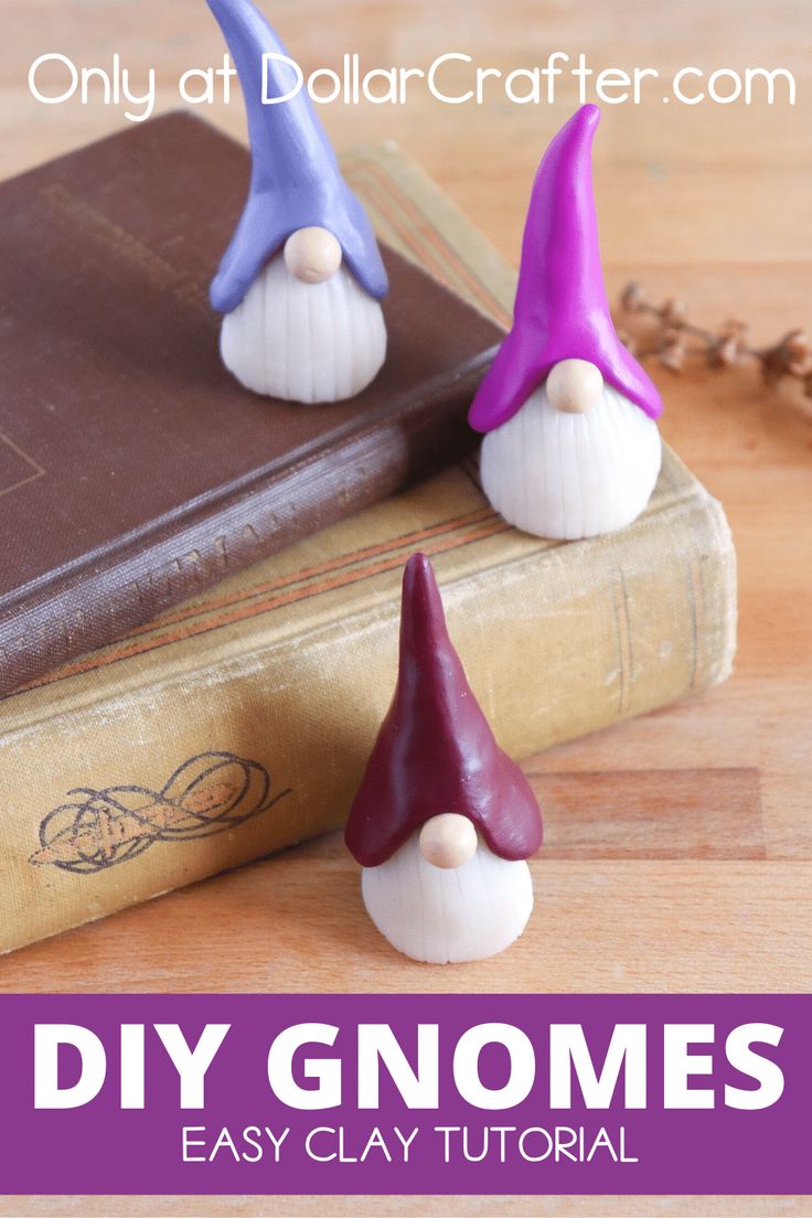 two gnomes sitting on top of a book with text overlay that reads, diy gnomes easy clay craft