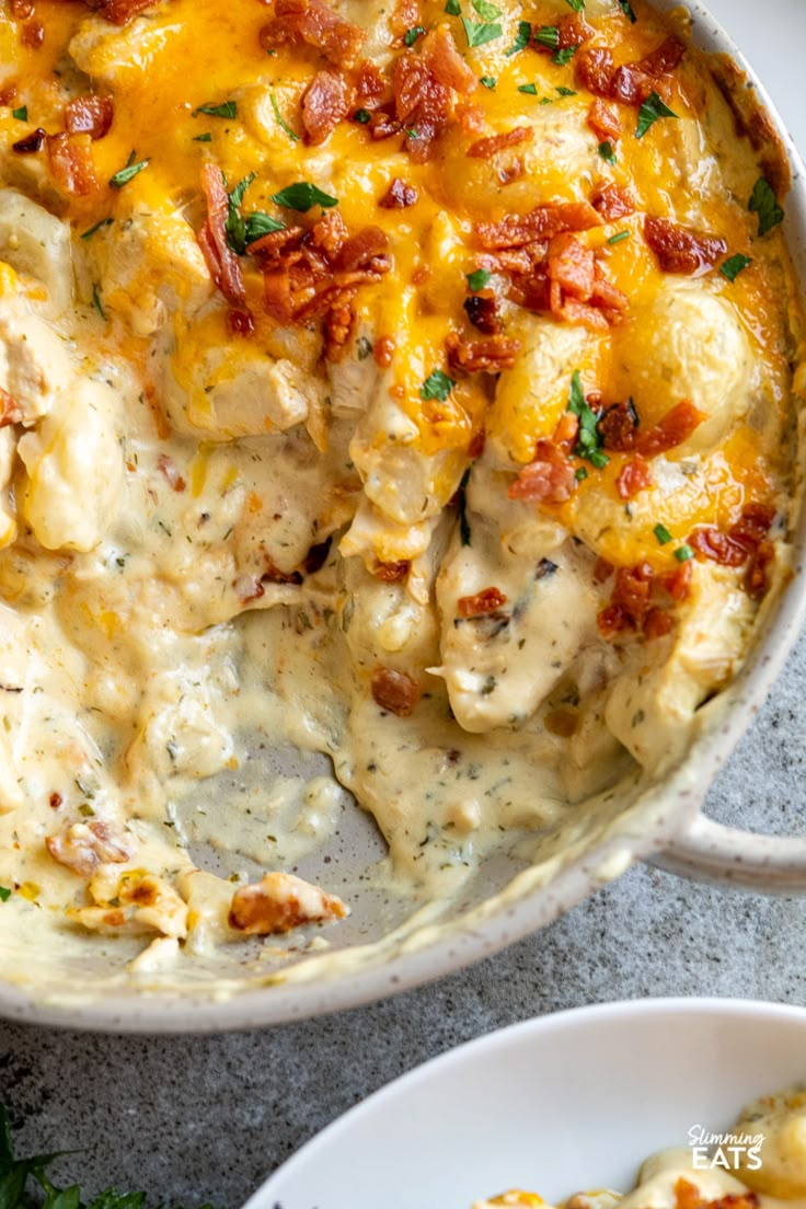 a casserole dish with chicken and cheese