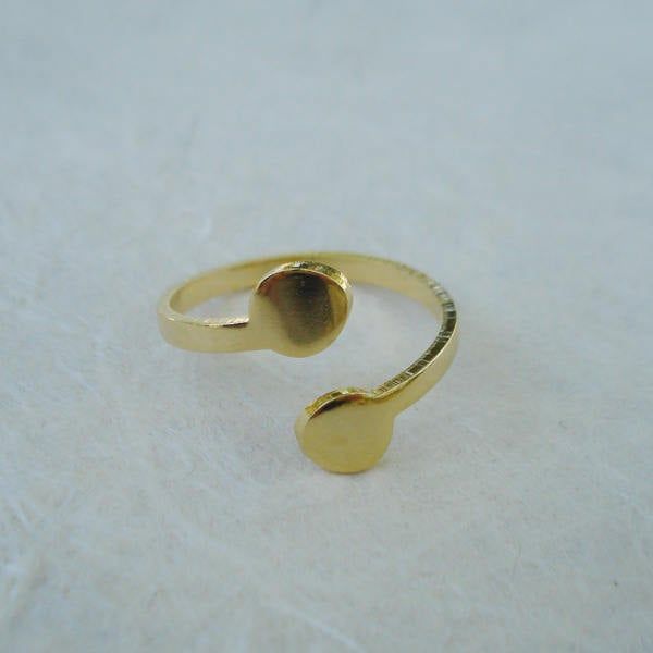 Size: Adjustable 2mm ring band with two 6mm pads Quantity: 3 Color: Gold Material: 14k gold plated brass Shape: Round pads Origin: Made and plated in the USA PLEASE NOTE: Please read my store policies before agreeing to purchase. **All sales are final** Gold Brass Midi Rings For Anniversary, Adjustable Round Midi Rings In Recycled Gold, Adjustable Recycled Gold Midi Rings, Adjustable Yellow Gold Ring Nickel Free, Adjustable Yellow Gold Nickel Free Ring, Gold Tarnish Resistant Stackable Rings, Nickel Free 14k Gold Rings, Adjustable Stackable Rings In Gold Plated Yellow Gold, Gold Stackable Rings Nickel Free For Anniversary