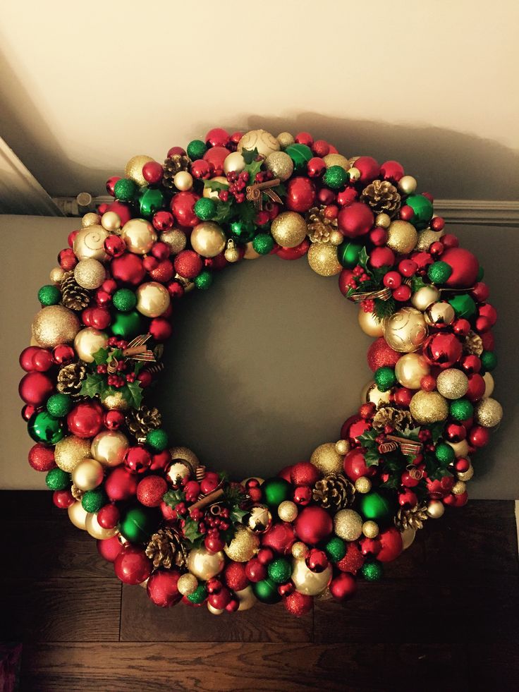 a christmas wreath is hanging on the wall