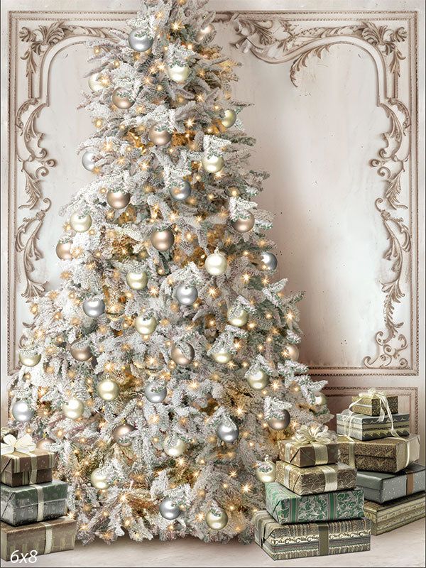 a white christmas tree with gold and silver ornaments