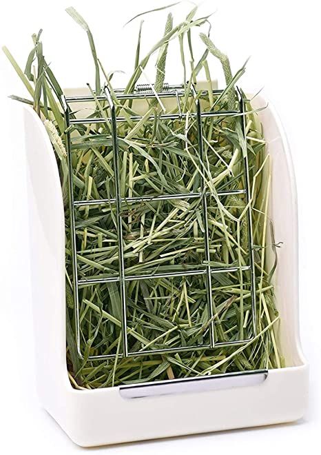 a white container filled with grass on top of a white table