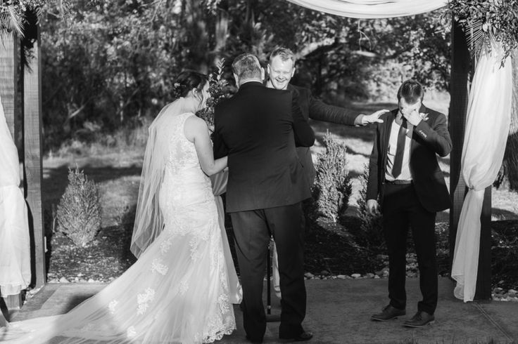 the bride and groom are getting married under an outdoor chute at their wedding ceremony