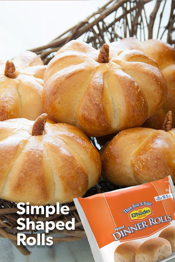 bread rolls in a wicker basket next to a packet of dinner rolls