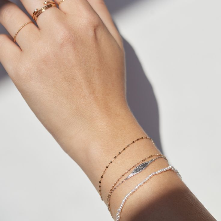 A reimagining of the classic ID bracelet, in classic Catbird proportions, by which we mean: tiny and shiny. Made to be engraved with something dear. Important notes for engraving: Maximum 9 characters (up to 2 letters can be capitalized) OR a total of 3 capital letters Engraving is limited to A-Z, 0-9, "+" (no ampersand or emojis) only Engraving must be typed exactly how you want it to appear. Any engraving that does not fit these rules will significantly delay your order. (Engraving included in Catbird Jewelry, Id Bracelets, Jewelry Lookbook, Custom Fonts, Bracelet Silver, Silver Bracelets, Delicate Bracelet, Girly Things, Sale Items