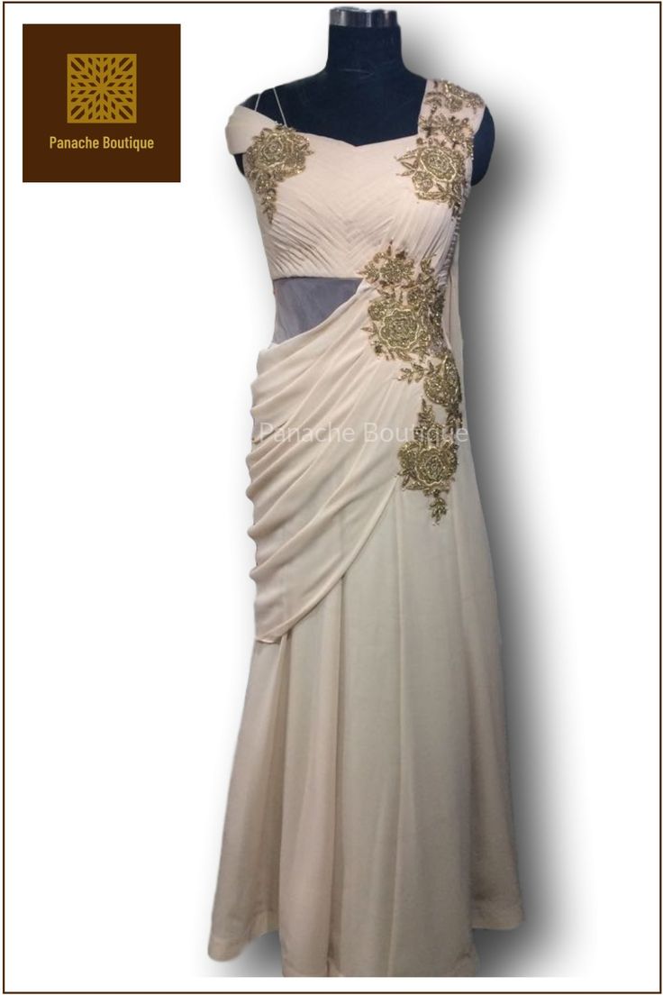 Outstanding Beige Colour Saree Gown In Georgette Presenting this outstanding Beige Colour Saree Gown In Georgette And Hand Embroidery with Zari, Stones and beads. This is a presentable outfit for a perfect occasion. The gown can be cutomised according to your wish. Fitted Evening Dress With Traditional Drape, Sleeveless Georgette Gown For Wedding, Hand Embellished Floor-length Evening Dress For Reception, Elegant Side Open Georgette Dress, Evening Embroidered Pre-draped Saree, Festive Side Open Georgette Dress, Sleeveless Dori Work Wedding Dress, Anarkali Evening Dress With Resham Embroidery For Wedding, Evening Gown With Resham Embroidery In Traditional Drape