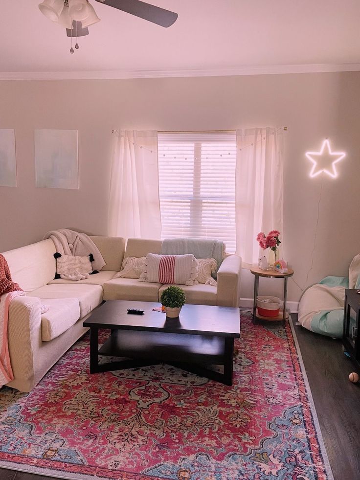 a living room filled with furniture and a large rug