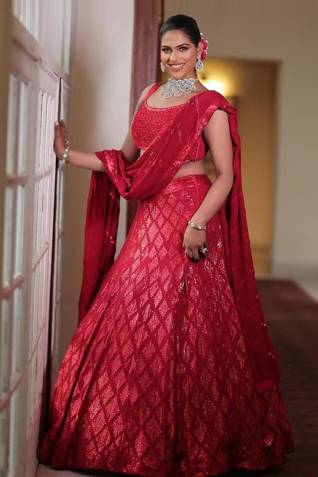 Red lehenga with attached cancan and sequins, cutdana embroidery in geometric motifs. Comes with embroidered padded blouse and dupatta.
Component: 3
Pattern: Embroidery
Type Of Work: Sequins, Cutdana
Neckline: Scoop
Sleeve Type: Sleeveless
Fabric: Georgette, Lining: Cotton Shantoon
Color: Red
Other Details: 
Fitted at bust and waist
Geometric embroidery
Occasion: Bride,Wedding - Aza Fashions Party Wear Red Lehenga With Dupatta, Red Party Wear Lehenga With Dupatta, Red Lehenga With Dupatta For Party, Red Lehenga With Mirror Work And Traditional Drape, Red Semi-stitched Party Wear Lehenga, Red Designer Party Wear Lehenga, Designer Party Wear Red Lehenga, Red Party Wear Choli With Traditional Drape, Designer Red Sequined Choli