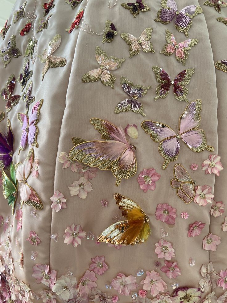 the back of a dress with butterflies on it