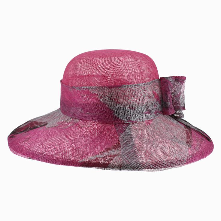 Designed by Complit Hats of Italy, the Belfry Via is an exquisite wide brim dress hat that features a hand-painted brim with bold splashes of silver and black artfully layered onto its soft cyclamen-colored body. The sinamay hat band is finished with a hand-painted triple layered bow. The brim offers a covered wired edge to maintain its classic shape and the interior has an adjustable drawstring that can be tightened for a better fit. FEATURESStyle: Wide Brim Dress HatMaterial: SinamayDimensions Summer Party Wide Brim Fedora, Elegant Adjustable Pink Fedora, Elegant Pink Adjustable Fedora, Summer Party Cloche Sun Hat, Wide Brim Sinamay Boater Hat For Evening, Summer Party Fedora With Short Brim, Elegant Pink Wide Brim Fedora, Summer Party Fedora With Curved Brim, Summer Evening Cloche Hat With Short Brim