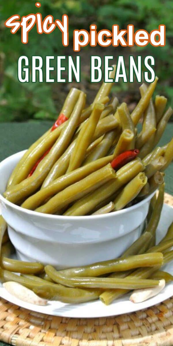 pickled green beans in a white bowl on a wicker tray with text overlay