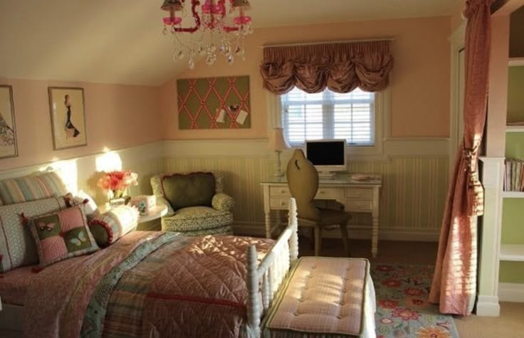 a bedroom with a bed, desk and chair in it's center area next to a window