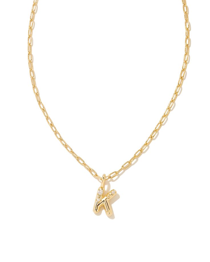 Personalize your everyday look with the Crystal Letter K Gold Short Pendant Necklace in White Crystal. Whether you’re rocking your initial or a loved one’s, this sentimental layer is one you’ll keep coming back to again and again. Metal 14k Gold Over Brass Material White CZ Closure Lobster clasp Size 16" chain w/ 3" extender, 0.62"L X 0.35"W pendantDue to the one-of-a-kind nature of the medium, exact colors and patterns may vary slightly from the image shown. | Kendra Scott Crystal Letter K Gold Letter A Necklace, 16 Wishes, Random Wishlist, Bday List, Short Pendant Necklace, Preppy Jewelry, Birthday Inspo, Gold Letter Necklace, Kendra Scott Necklace