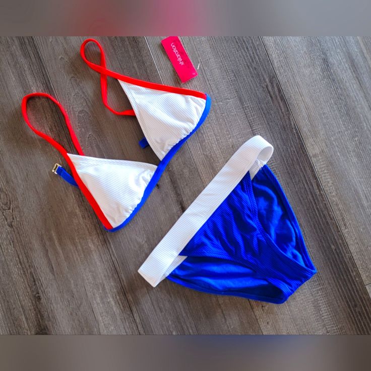 New With Tags Triangle Top Bikini From Target. Bottoms Are A Size Small & Bottoms Are A Size Medium. Has A Ribbed Texture And Removable Pads. Colors Are Red, White, And Blue. No Holes, Stains, Rips, Or Tears. Comes From A Smoke Free And Pet Free Environment. Blue Triangle Swimwear For Beach Season, Summer Party Triangle Swimwear, Red Triangle Top Swimwear For Summer, Blue Triangle Top Swimwear For 4th Of July, Blue Triangle Swimwear For Beach, Red Triangle Top Swimwear, Red Printed Triangle Top Swimwear, Black Swimsuit Top, Micro-elastic Triangle Top Swimwear