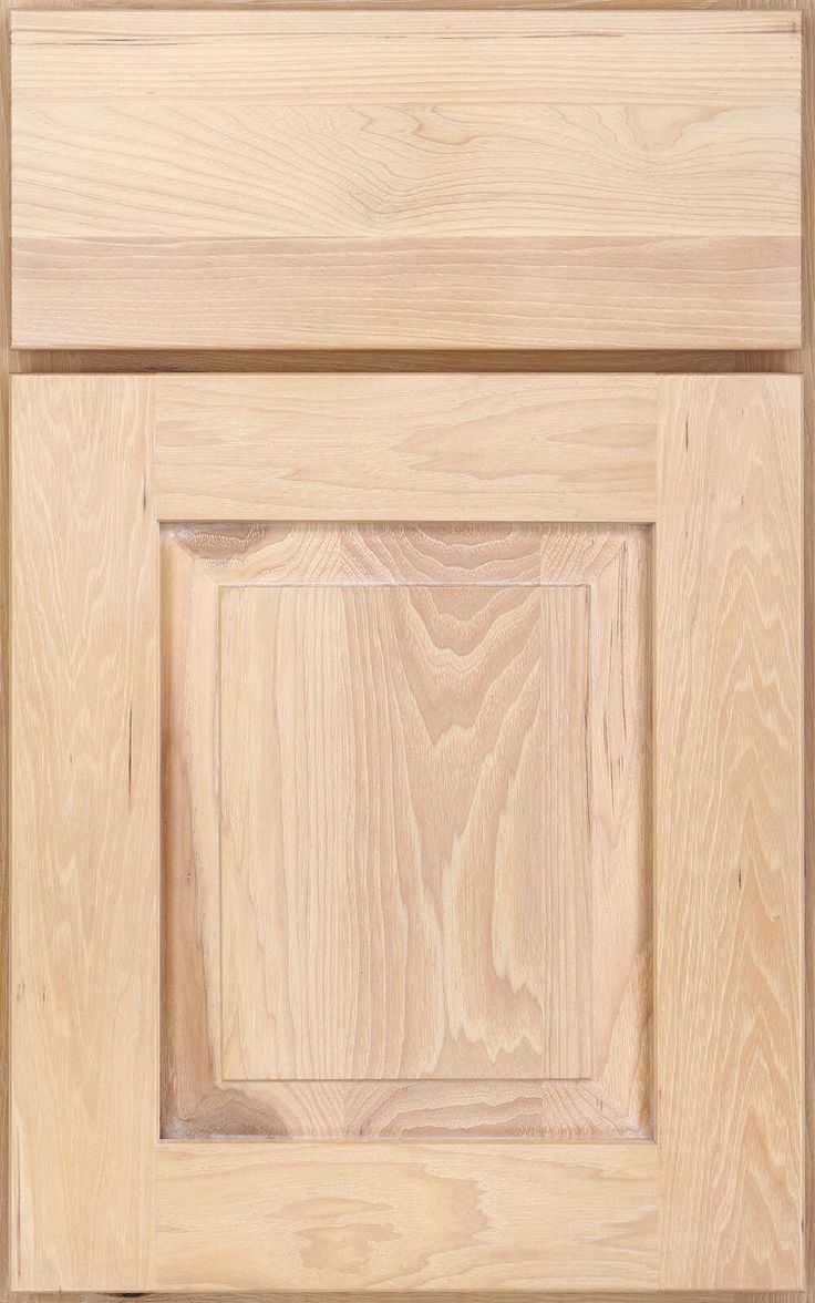 an unfinished wooden cabinet door with no drawer