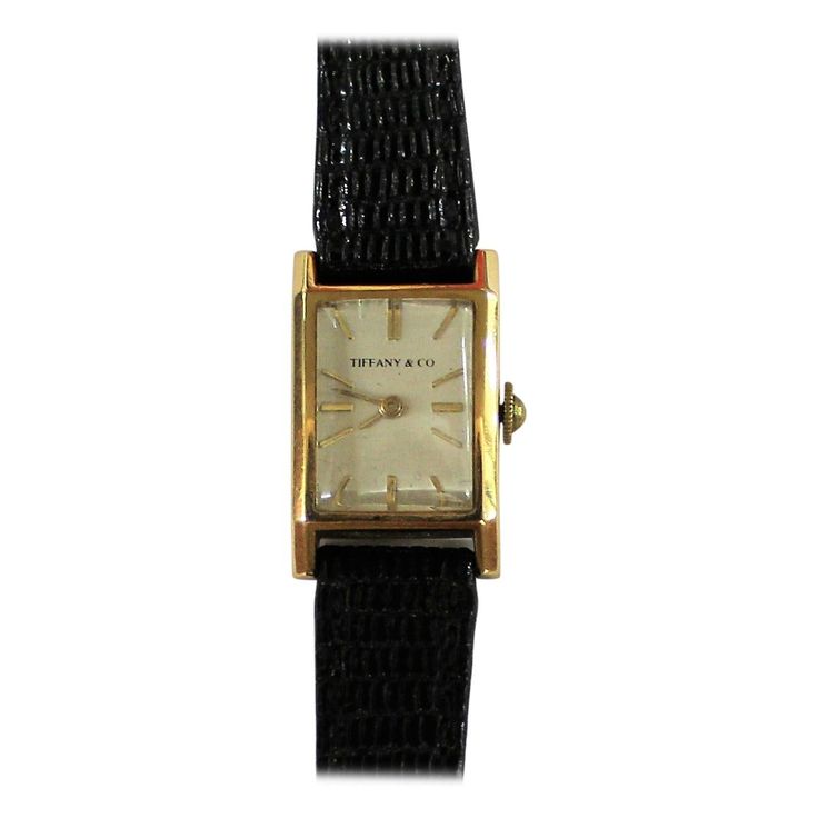 Elegant vintage Tiffany & Co. manual wind dress watch made with 18-karat yellow gold. It is slender and has a soft rectangular design. Elegant Gold Square-faced Watch, Elegant Gold Square Face Watch, Art Deco Rectangular Watch With Diamond Hour Markers, Art Deco Rectangular Watch With Diamond Markers, Classic Gold Watch With Square Face, Yellow Gold Business Watch With Rectangular Shape, Yellow Gold Business Watches With Rectangular Shape, Vintage Yellow Gold Rectangular Watch, Vintage Rectangular Yellow Gold Watch