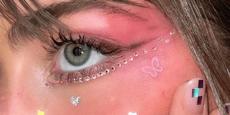 a woman's eye with glitter on it