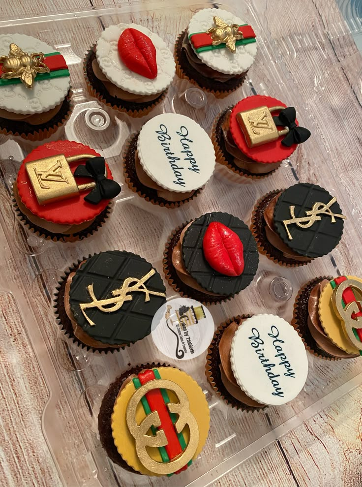 cupcakes decorated with different designs and colors