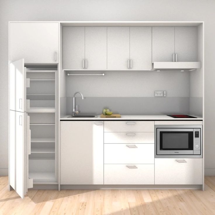 an empty kitchen with white cupboards and appliances