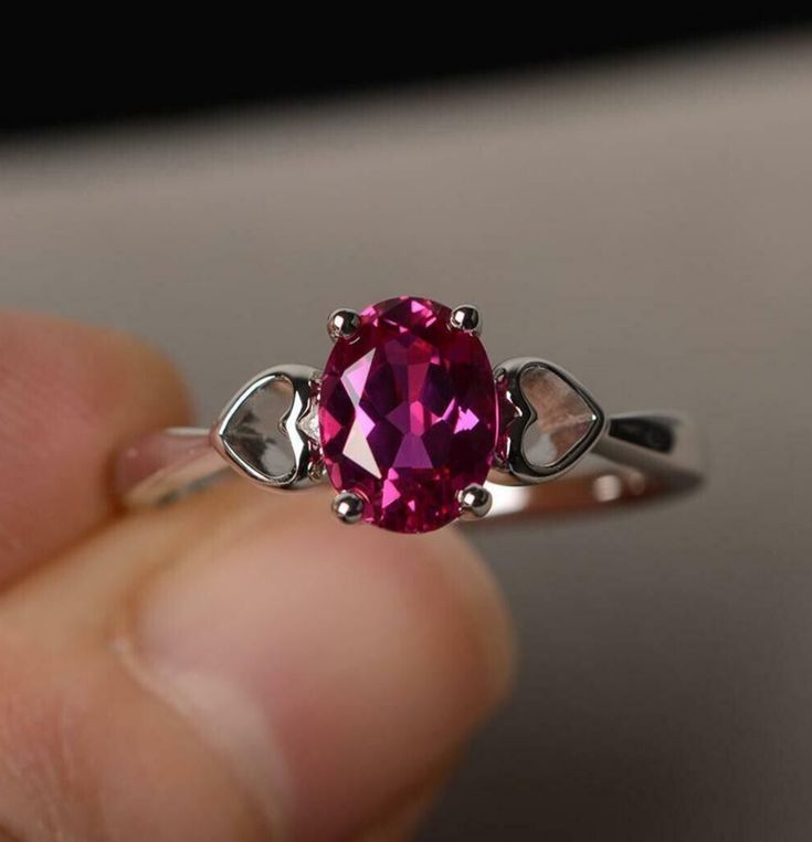 "Show your love with our Pink Oval Cut Simulated CZ Solitaire Promise Ring. Made from high-quality 925 Sterling Silver, this ring features a dazzling pink oval-cut CZ stone that symbolizes your promise to cherish your loved one forever. It's the perfect choice for an engagement, anniversary or simply a special way to say 'I love you'." #pinkczring #solitairering #925sterlingsilver #promisering #herpromisering #affordablejewelry #loversring #ovalcutring #weddingjewelry #anniversarygift