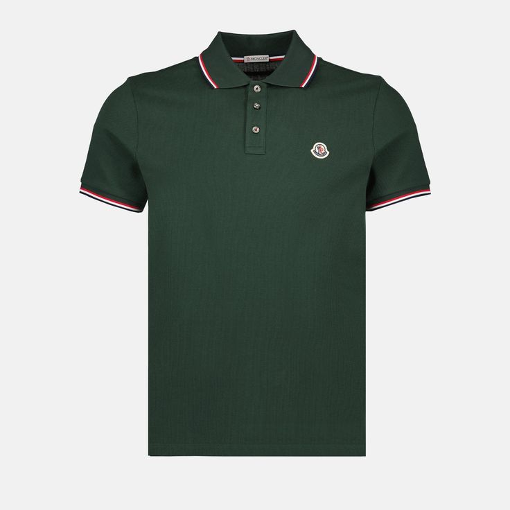 • Classic collar
 • Short sleeves
 • Straight cut
 • Three-button closure
 • Moncler logo in felt on the front
 • Solid color
 • Made of pique cotton
 • Several colors available
 • Tricolor edging on the collar and sleeves Green Polo Shirt, Semi Formal Attire, Moncler Logo, Gentleman's Wardrobe, Green Polo Shirts, Green Polo, Polo Logo, Polo Jeans, Formal Attire