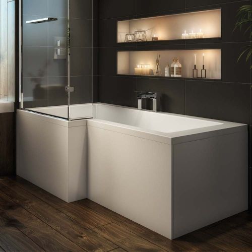 a bathroom with a bathtub, shelves and candles on the wall next to it