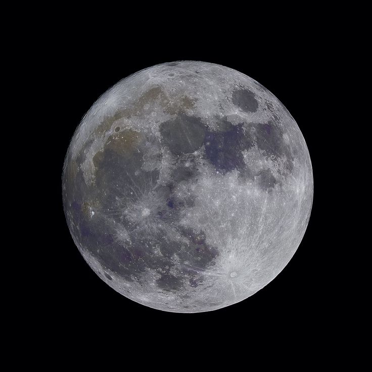 the full moon is seen in the dark sky