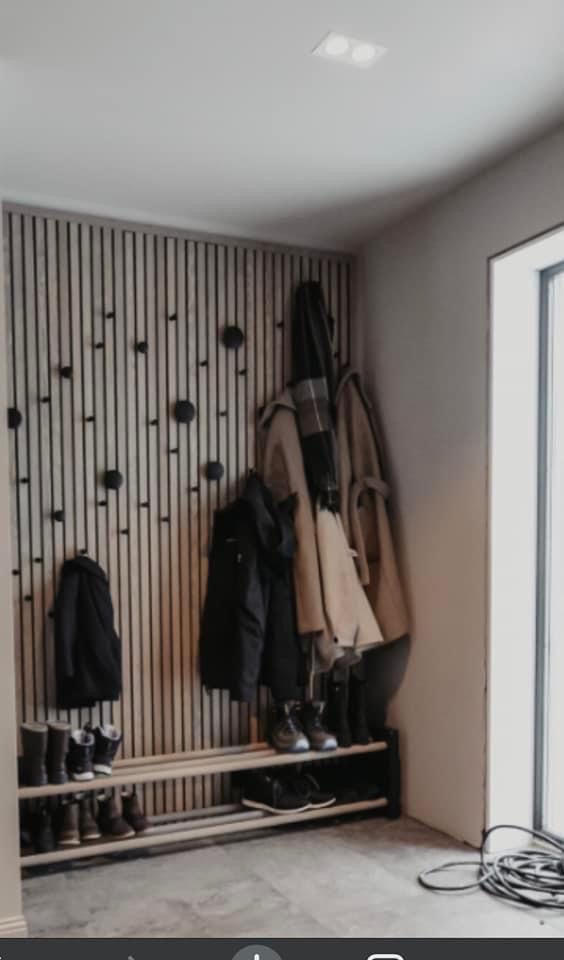 a coat rack with coats hanging on it