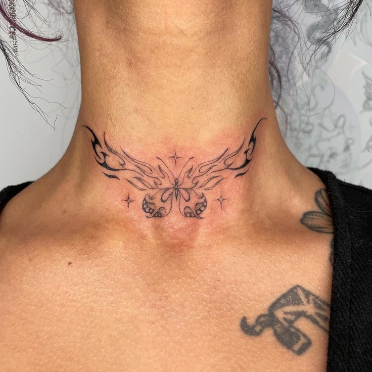 a woman with a tattoo on her neck