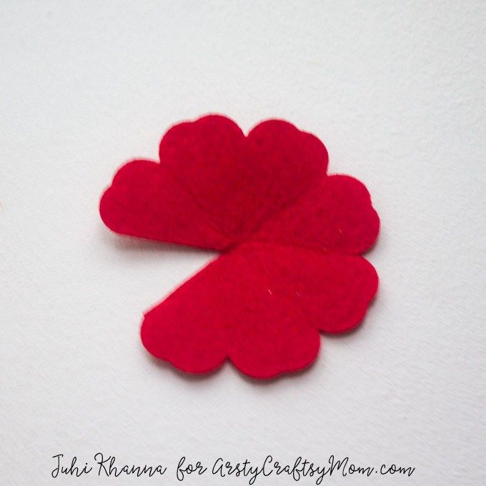 two red felt hearts sitting next to each other