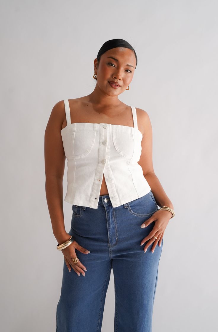 Denim on denim is making a comeback with our Siren Denim Top white out! A new take on our previous design, with matching stitching to compliment this wear-on-repeat item. A top made to be seen - wear this one with any of your denim pieces in your wardrobe for the ultimate cool girl vibe! With a flattering straight neckline and adjustable shoulder straps, this structured top will be a timeless piece in your wardrobe. Why you'll love this: Take her from the office to drinks with no fuss, she is th Trendy Denim Tops For Day Out, Chic Medium Wash Tops For Everyday, Chic Everyday Medium Wash Tops, Spring Dark Wash Cotton Denim Top, Chic Dark Wash Cotton Tops, Trendy Cotton Denim Top For Day Out, Chic Medium Wash Cotton Denim Top, Trendy Medium Wash Cotton Denim Top, Dark Wash Cotton Denim Top For Day Out