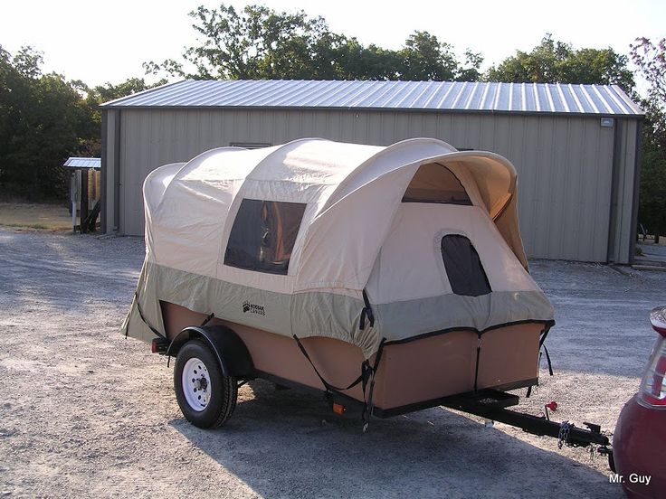 a trailer with a tent attached to it