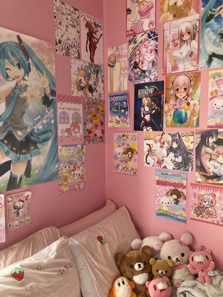 a bedroom with pink walls and anime pictures on the wall, stuffed animals are placed in front of the bed