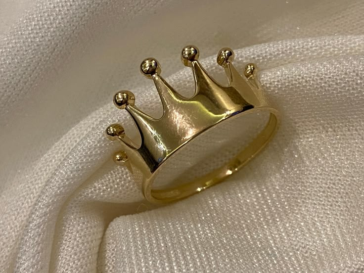 ABOUT PRODUCT This 14K Gold Crown Ring is suitable gift for girlfriend, mom and her. You can even buy as a birthday gift for your friends or anniversary gifts, If you want to add a special note we can write for you and put to inside of package. Princess Crown is a protection symbol in your life and its good luck symbol of jewelry. Show your love to your loved ones with this beautiful crown ring. We manufacture our jewelry pieces with carefully and after production we double checking in quality c Luxury Round Jewelry For Birthday, Valentine's Day Elegant Crown Design Jewelry, Elegant Crown Design Jewelry For Birthday, Elegant Crown Design Jewelry For Birthdays, Luxury Crown Design Rings For Anniversary, Gold Ring Jewelry For Birthday Gift, Gold Ring For Birthday Gift, Elegant Gold Rings For Birthday, Luxury Anniversary Rings With Crown Design