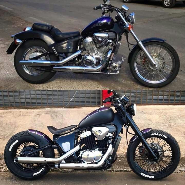 two motorcycles parked next to each other on the street