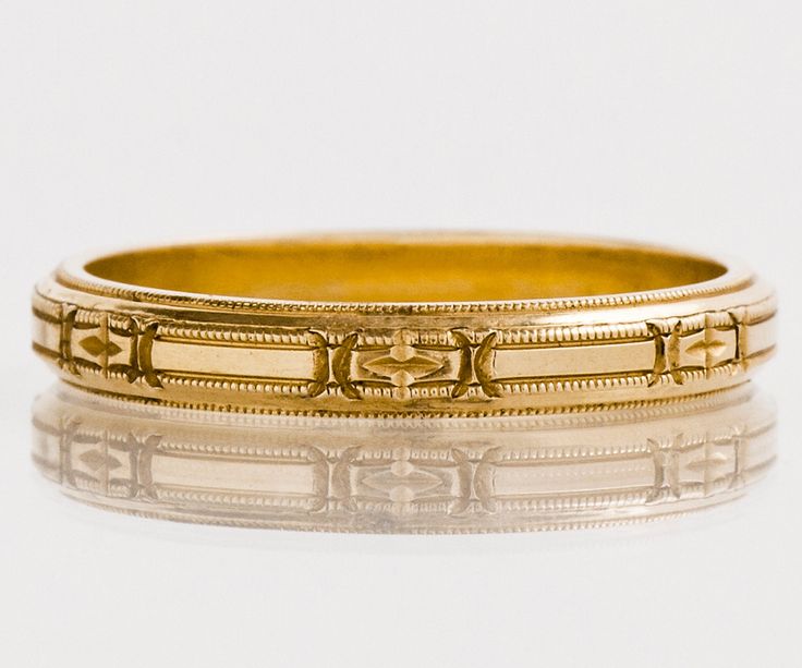 "This gorgeous and crisp antique wedding band is just one of many unique bands we recently acquired through one mans personal collection over the past 100 years. As yellow gold was rarer to the time period than white gold or platinum, we have such an appreciation for the fineness and craftsmanship of these bands as they were never worn, only admired from afar. This ring is as magnificent today as the day it was handmade. Original 1920's Antique Wedding Band 14k Rose Gold Etched Marked \"White Ro Heirloom Yellow Gold Bands With Decorative Details, Classic Yellow Gold Band With Intricate Design, Heirloom Round Band With Intricate Design, Ceremonial Yellow Gold Wedding Band With Decorative Details, Heirloom Milgrain Bands For Anniversary, Heirloom Ceremonial Engraved Ring With Decorative Band, Heirloom Engraved Ring With Decorative Band For Ceremonial Occasions, Heirloom Rings With Decorative Band, Victorian Engraved Ring With Decorative Band For Anniversary