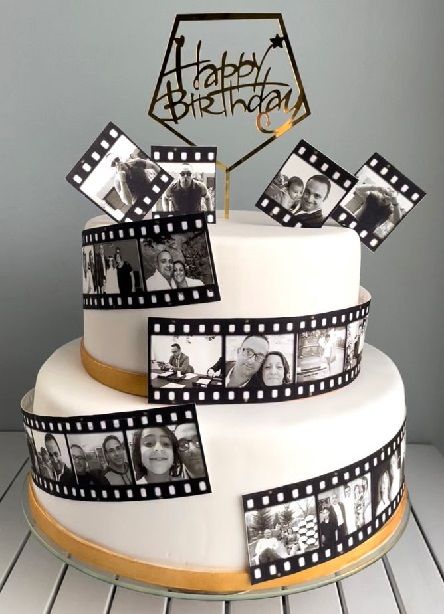 a birthday cake decorated with film strips and photos