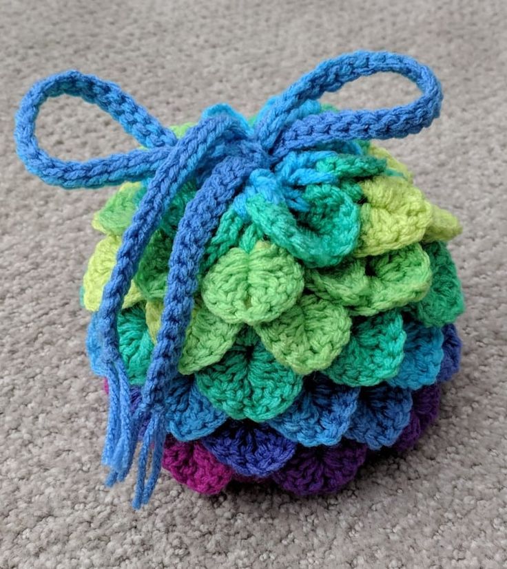 a ball of crochet sits on the floor