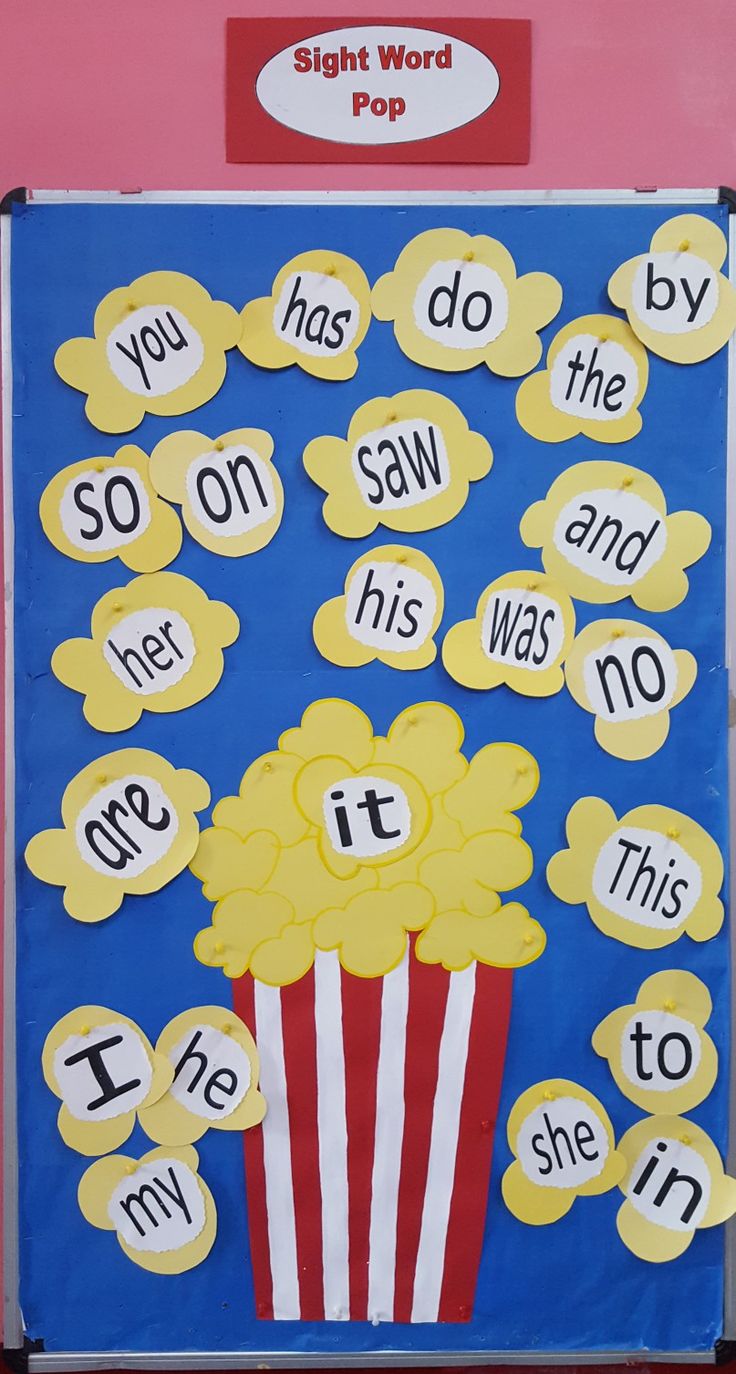 a bulletin board with words written on it and a popcorn in the middle that says sight word pop