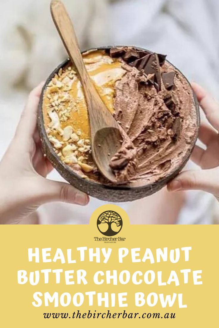 a person holding a bowl with chocolate and peanut butter in it that says healthy peanut butter chocolate smoothie bowl