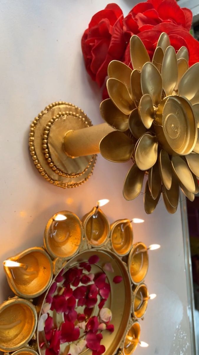 decorative items displayed on white surface with red flowers