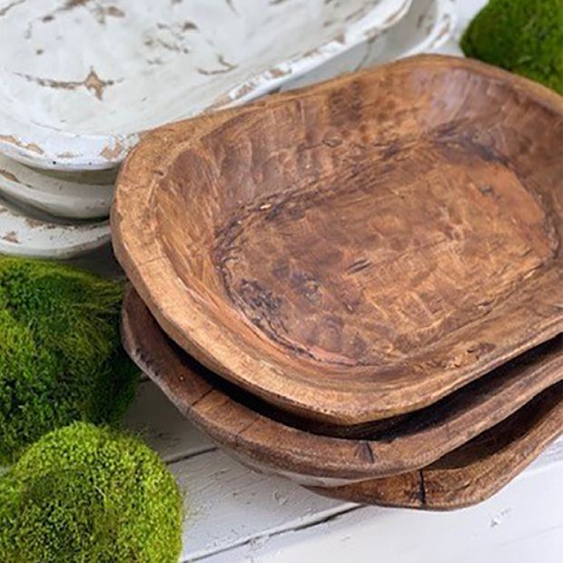 three wooden bowls with moss growing on them