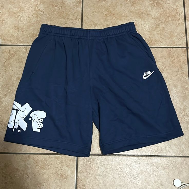 Brand New Never Worn Navy Casual Athletic Shorts For Streetwear, Casual Navy Nike Athletic Shorts, Nike Navy Bottoms For Streetwear, Navy Short Bottoms For Streetwear, Nike Navy Cotton Bottoms, Nike Navy Shorts For Summer, Blue Athletic Shorts With Pockets For Streetwear, Navy Cotton Nike Bottoms, Blue Streetwear Athletic Shorts With Pockets