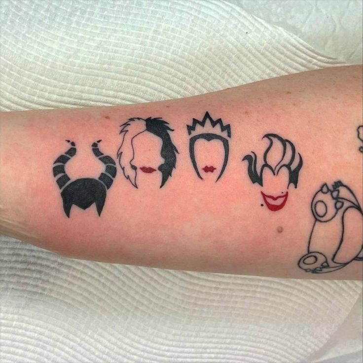 an arm with some tattoos on it that has different faces and haircuts drawn on it