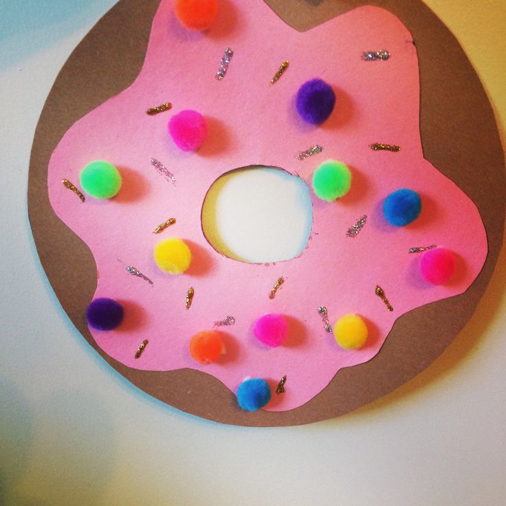 a pink doughnut with sprinkles on it