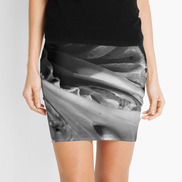 a black and white photo of a woman's skirt with an abstract design on it