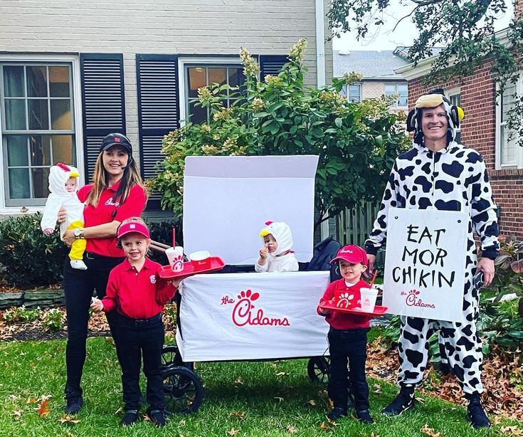 two adults and three children dressed up in costumes