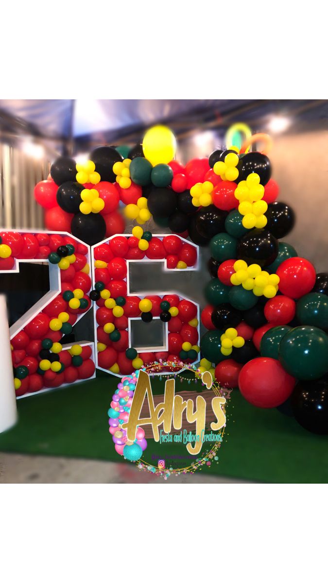 balloons are arranged in the shape of numbers on display at an arts and crafts event