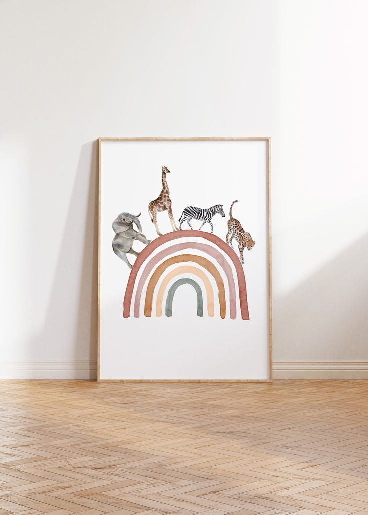 an art print with giraffes and zebras on a rainbow in front of a white wall