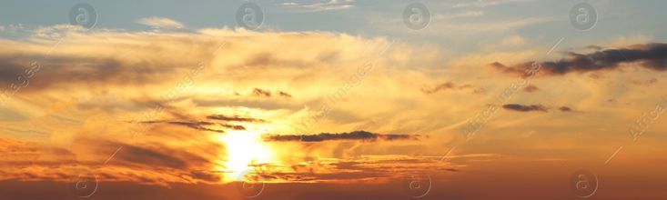 the sun is setting over the ocean with clouds in the sky and water below it